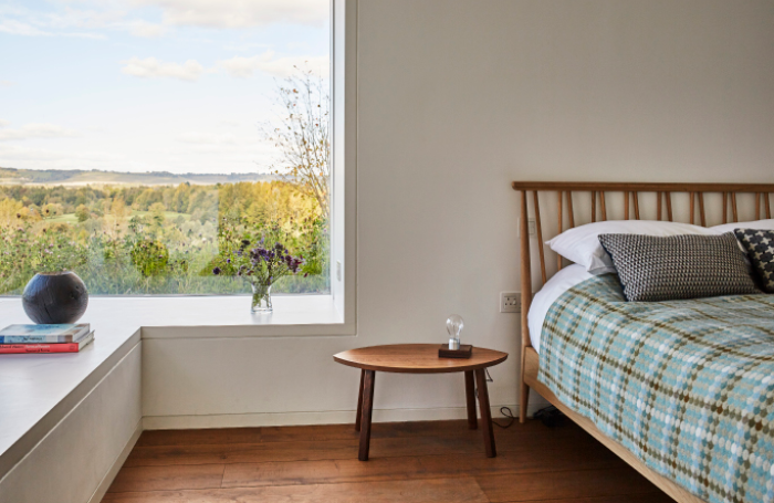 A Caring Wood family home bedroom by London Architects Macdonald Wright and Welsh Practicepng