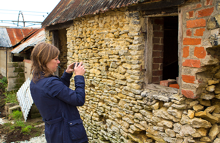 Clare Nash photographing old stone building exteriorjpg