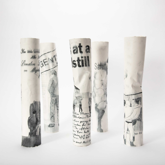 Five tall thin sculptures with etchings by Alastair Walkerjpg