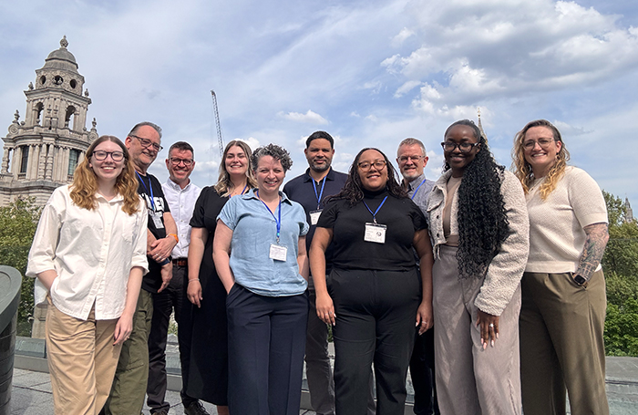 Members of the BE Inclusive group standing on a sunny rooftopjpg
