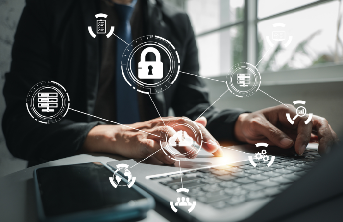 Web of cyber security icons with white man hands typing on laptoppng