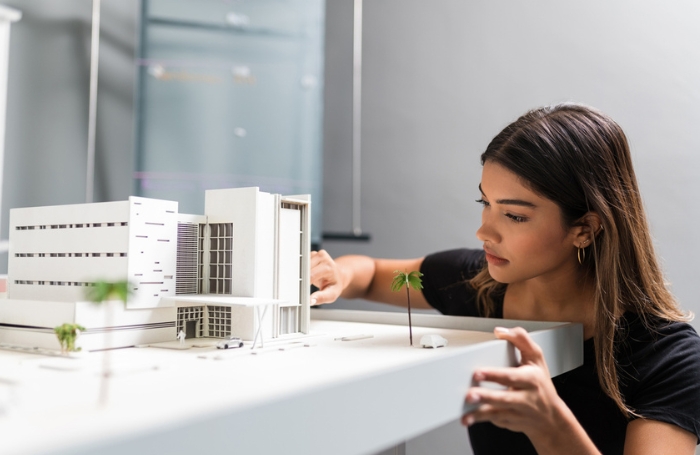 Architecture apprentice works on a modeljpg