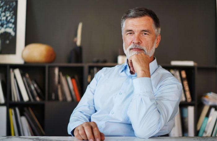 Architect sits behind a desk in his officejpg