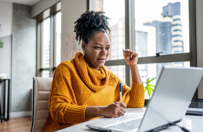 Female architect working on a laptop in an office GC LARGEjpg