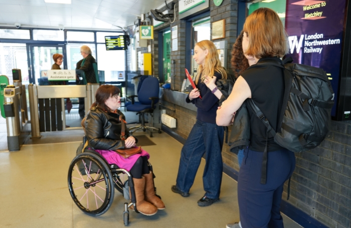 Group of architects and a wheelchair user at a train station GC LARGEjpg