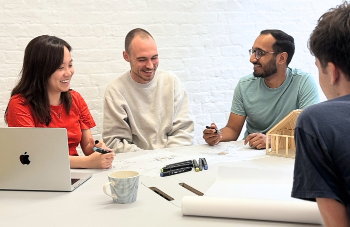 Group of architects working around a tablejpg