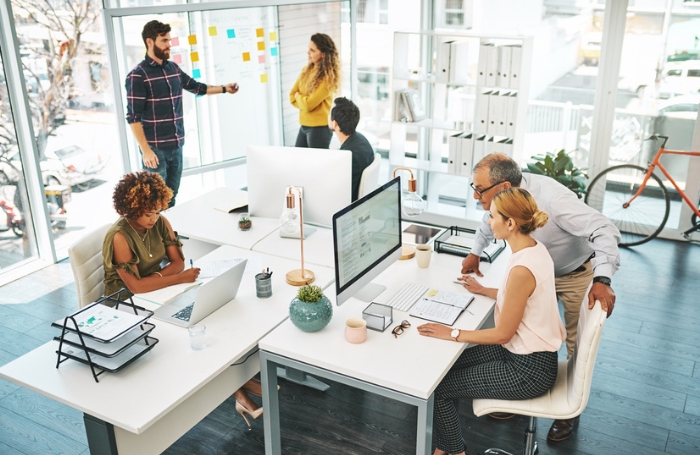People working in a small architecture officejpg