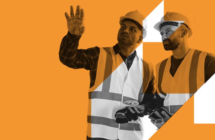 Two architects looking at something and pointing on a building site LARGEjpg