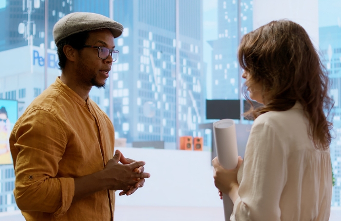 Two people chatting at an arvchitecture degree showjpg