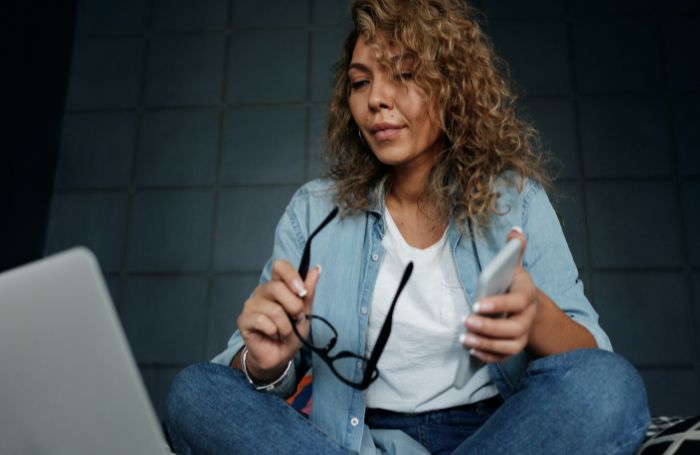 Woman reading dosuments on her laptopjpg