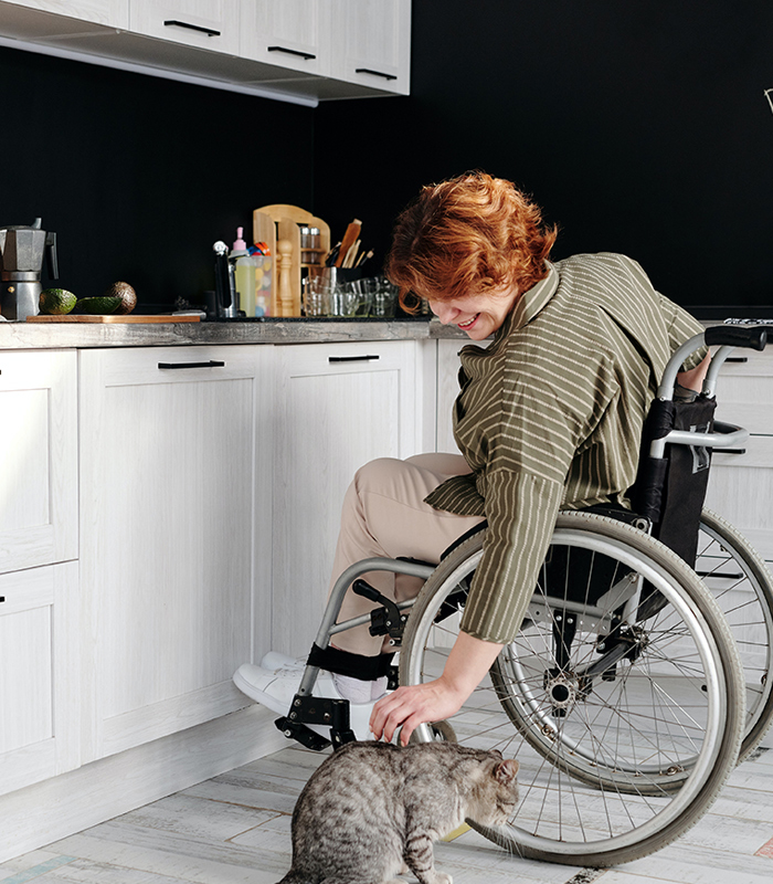 womaninwheelchairinkitchenpexelsimagebody700x800jpg
