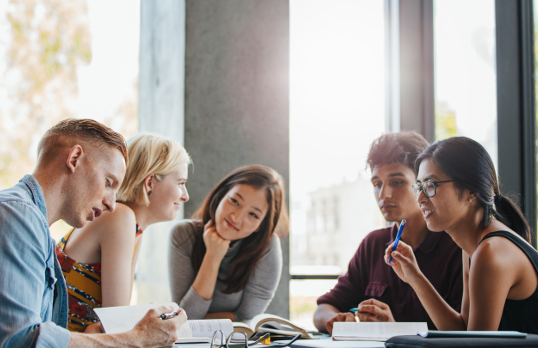 People discussing work in an office meeting