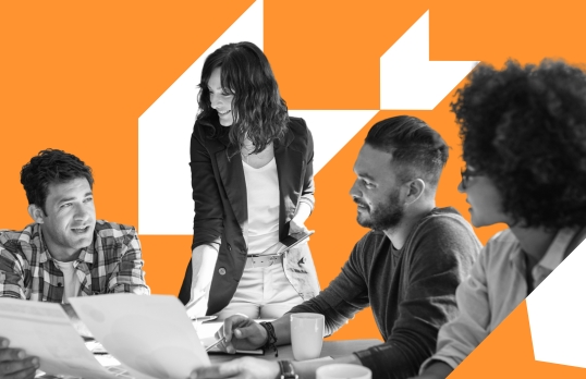 Group of architects at a table with orange background