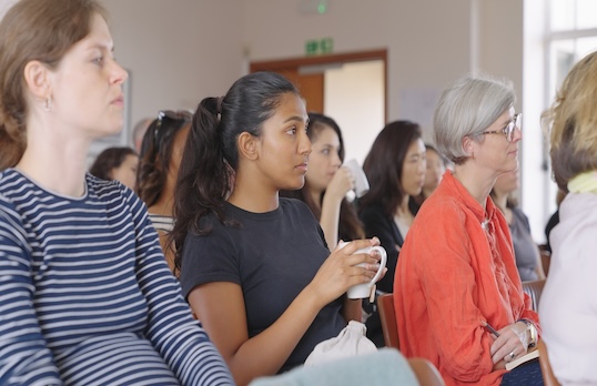 People seated during an event presentation