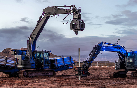 Blue autonomous excavators digging 