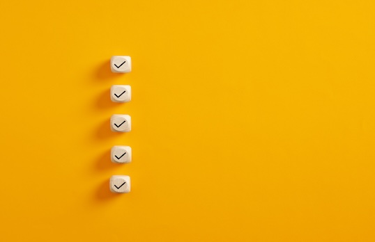 Graphic of blank checklist on yellow background