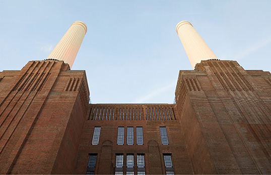 Upward view of Batter Power Station and two front chimneys 
