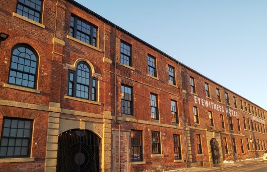 Red brick factory building with blue sky