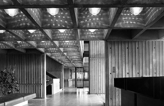 County Offices, Newton St Boswells, Roxburghshire (Phase 1): the entrance hall with staircase and lift, showing the exposed concrete coffered ceiling and walls
