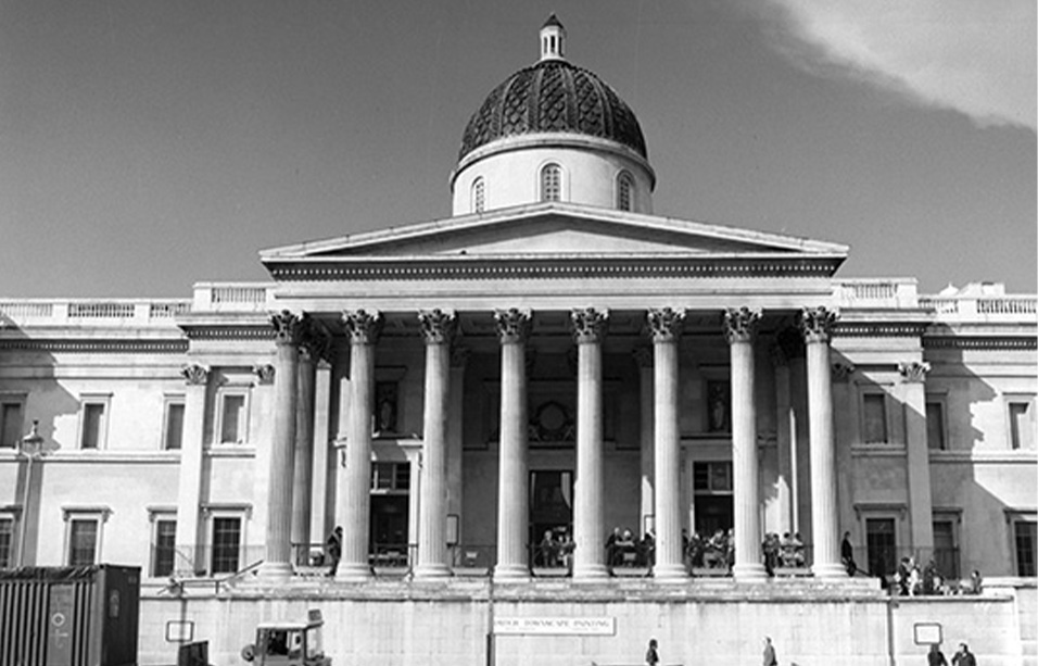 Black and white photograph of the National Gallery in London with neoclassical columned front and round tower with dome roof