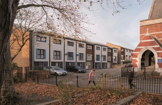 Row of externally clad retrofitted houses on streetscene