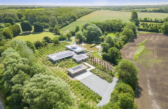 Single storey modern square buildings in countryside landscape
