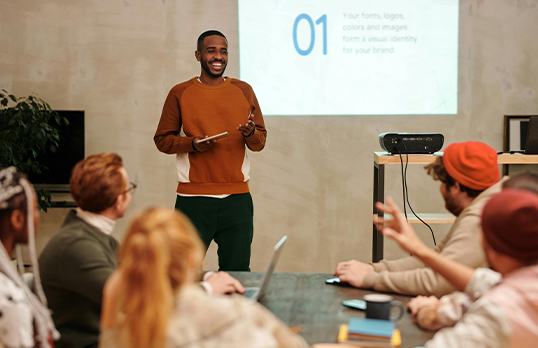 Man giving a staff training induction to group