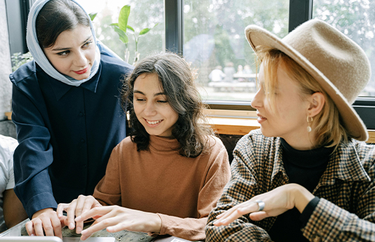 Two women role-modelling for a younger student