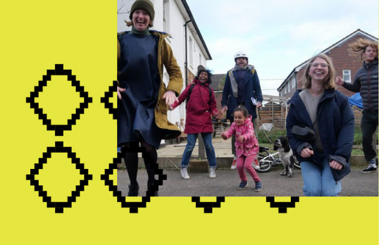 Children and adults jumping outside