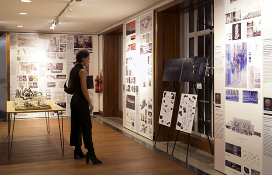 A woman views items in the Presidents' Medals exhibition
