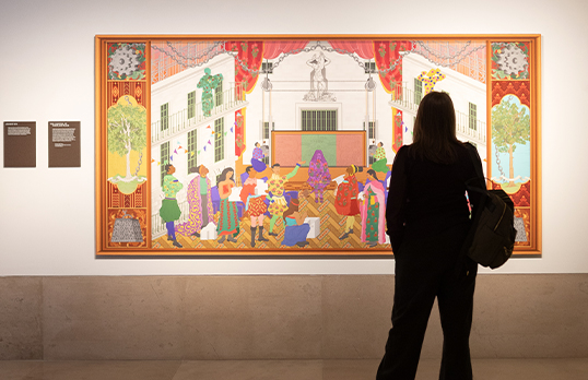 Person looking at a painting in a gallery