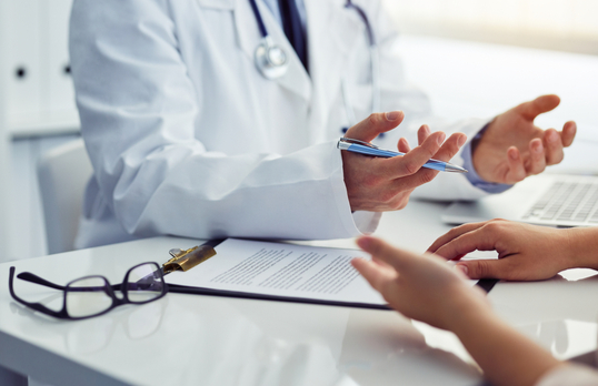 Doctor speaking to patient