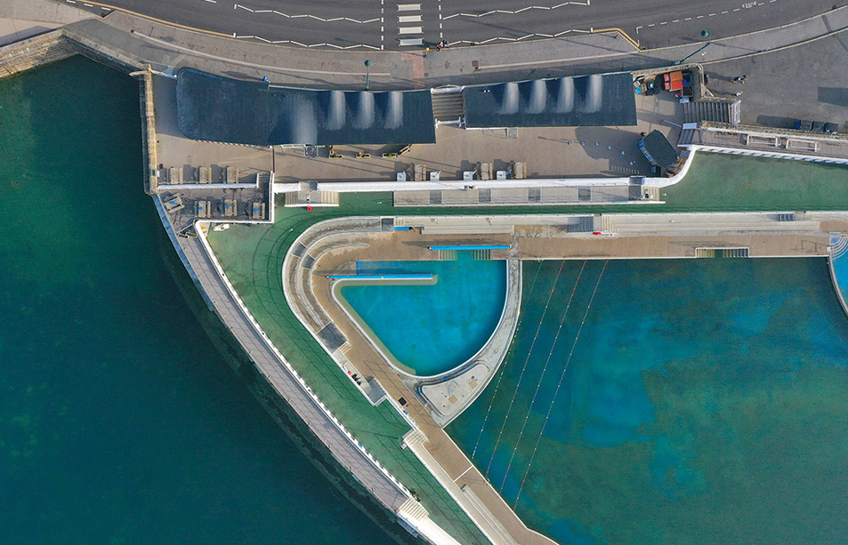 Aerial view of a swimming pool surrounded by other bodies of water