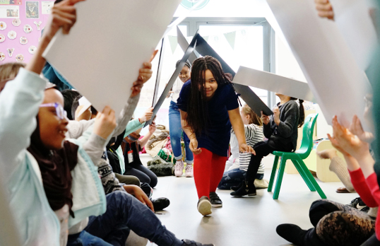 Girl walks under boards on Architecture Ambassadors programme