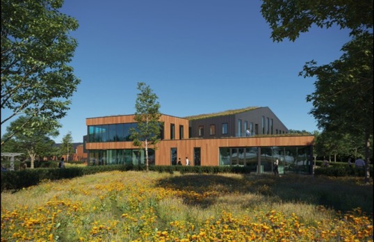 Large wooden clad building with large glass walls and plentiful wild gardens and trees