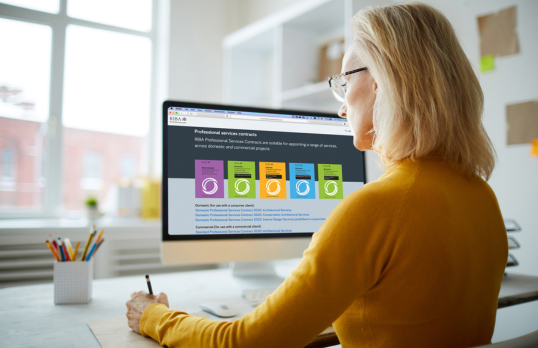 Woman looking at digital contracts on screen