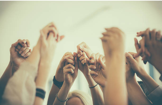 inclusive hands holding one another