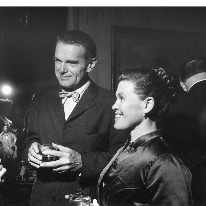 Black and white image of Charles and Ray Eames in evening dress